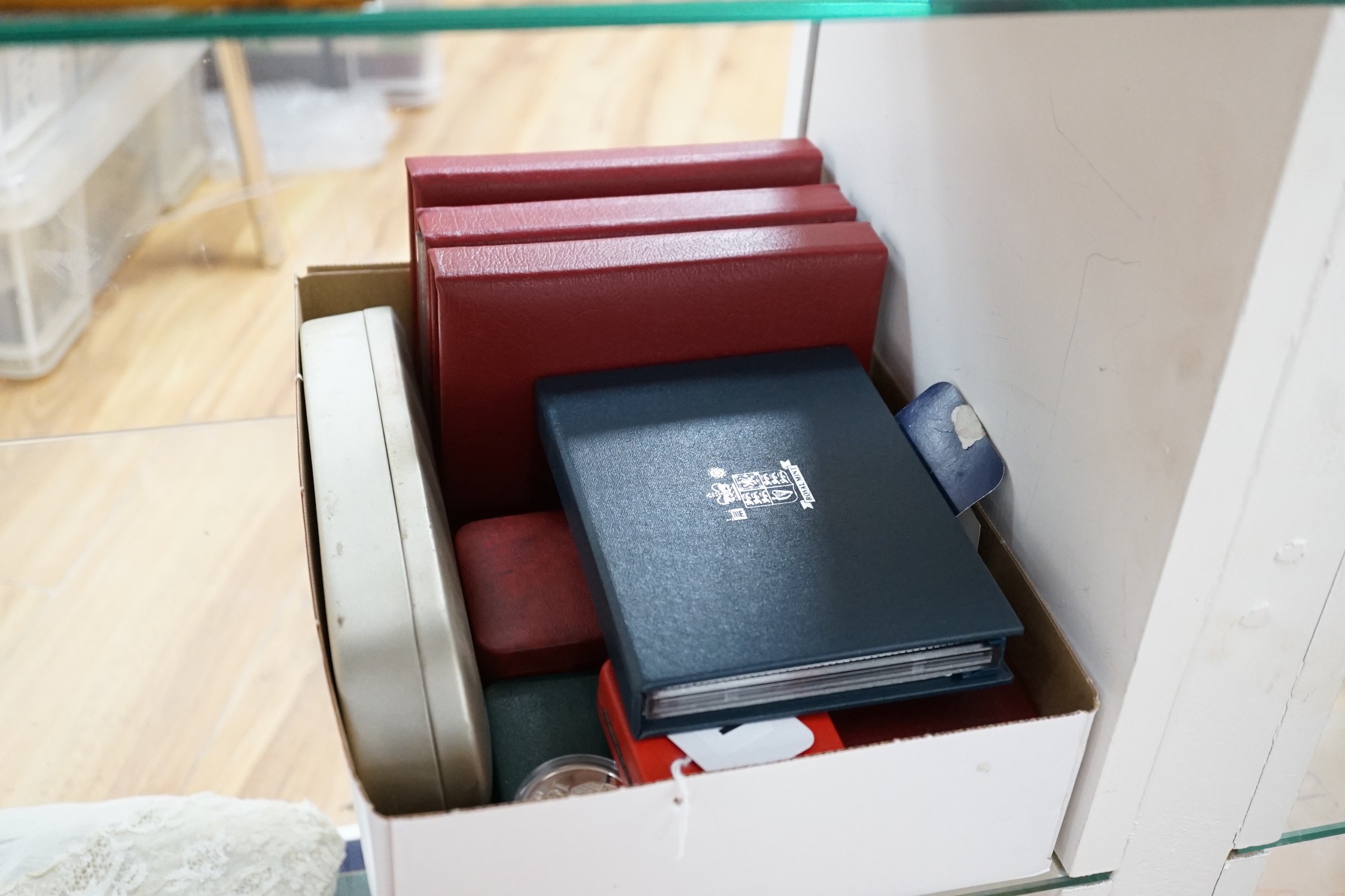 A collection of Royal Mint UK proof or BUNC commemorative coins etc.